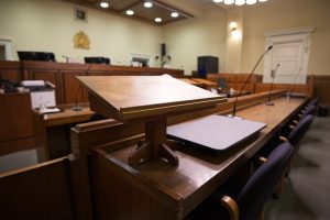 Michigan criminal arraignment courtroom showing the judge's bench and counsel tables.