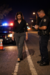 Woman performing walk and turn field sobriety test during Michigan DUI investigation