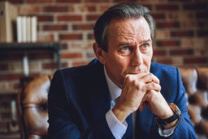 Person facing third offense DUI felony charge in Michigan consulting with OWI defense attorney